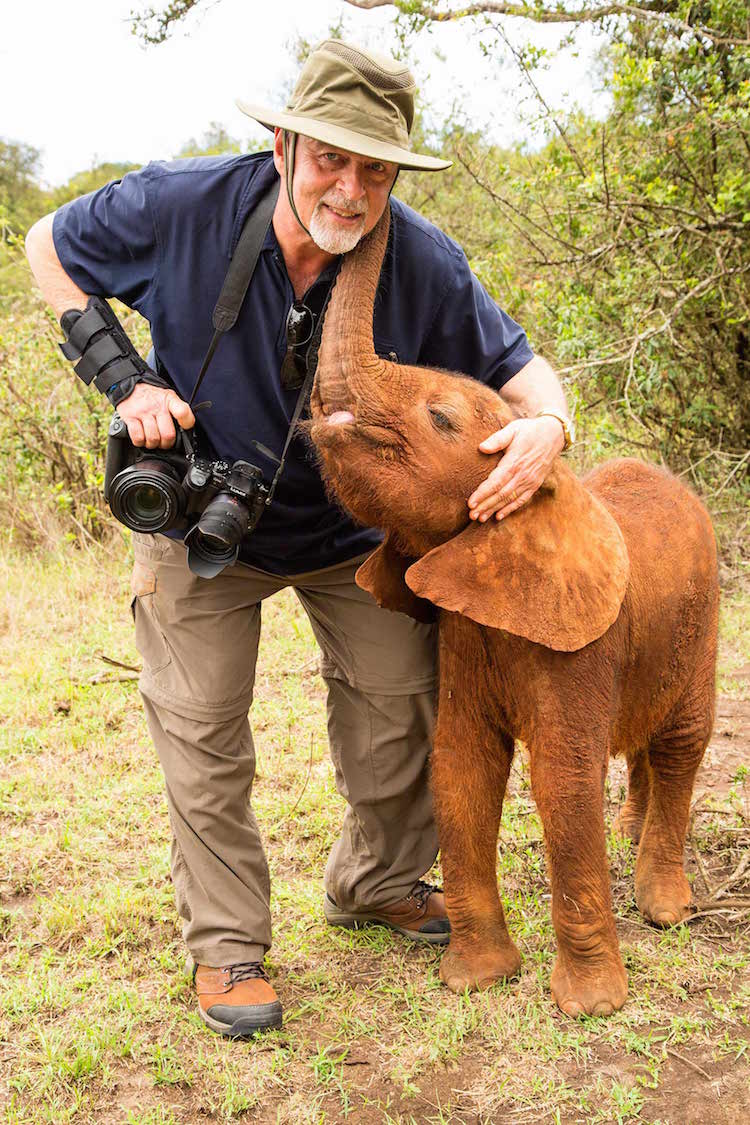 Steve Mandel with baby African elephant © 2014, Carol Foote